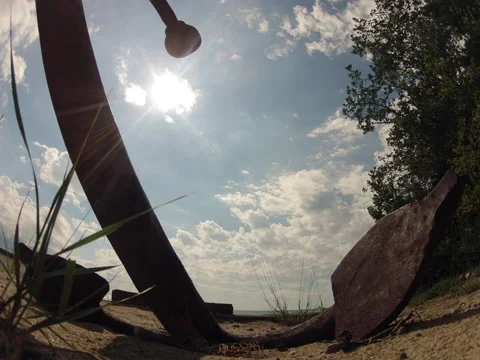 Time Lapse Anchor on Sandy Beach, Sun and Clouds Stock Footage 41531122