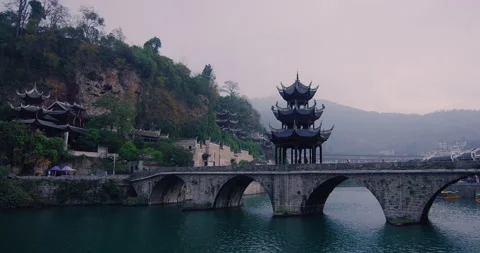 Time lapse of ancient city bridge on a cloudy day in Zhenyuan China. Shot on red 스톡 동영상 201094401