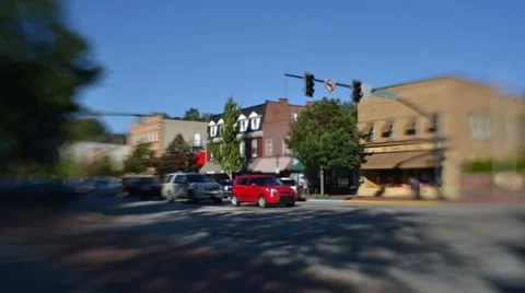 Time Lapse and Tilt Shift Shot of Traffic at a red light in a small town Stock Footage 58015322
