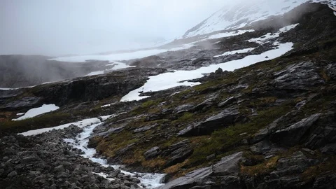 Time Lapse of Andalsnes Snow Capped Mountain Clear Creek Flowing Winter Nature Stock Footage 104957102