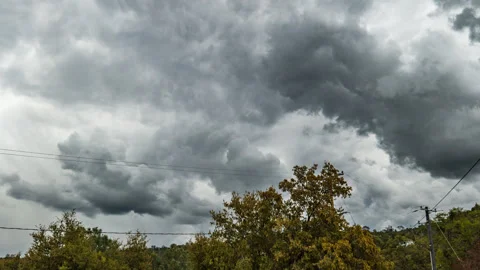Time Lapse of Angry Gray Clouds above Utility Poles and Lines Stock Footage 278467244
