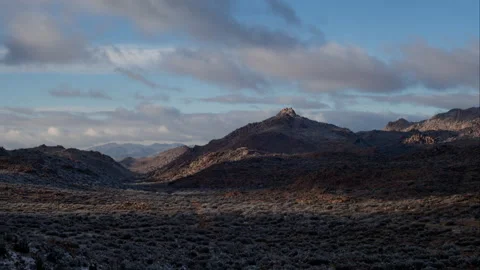 Time lapse of approaching cloud shadows over a snowy desert valley in Arizona Stock Footage 147349970