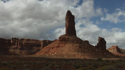 Time lapse of approaching clouds casting shadows on sandstone rock spires Stock Footage 197013440
