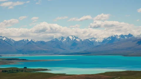 Time Lapse - Ariel View of Lake Tekapo with Mountain Range Video stock 66863305