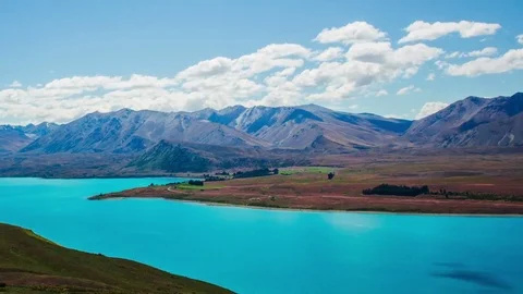 Time Lapse - Ariel View of Lake Tekapo with Mountain Range Stock Footage 76918238