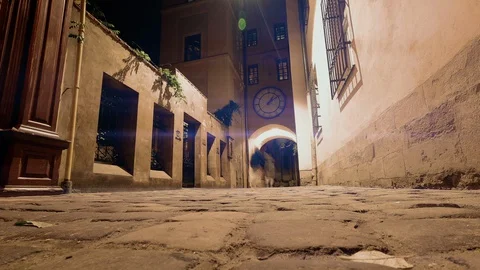 Time lapse artificial lighting clock and people ancient street Stock Footage 128125383