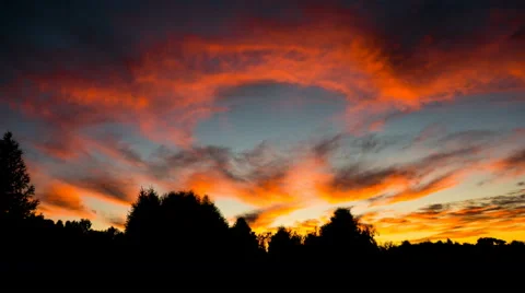 Time lapse of attractive sunset with cloudscape over forest Stock Footage 65257125