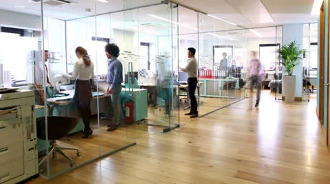 Time lapse of attractive young professionals at work in busy modern office Stock Footage