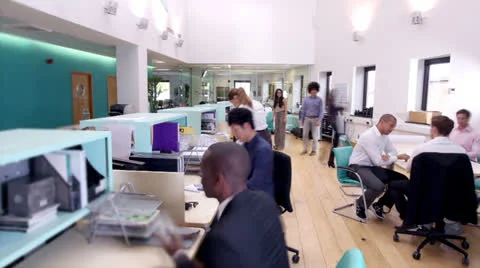 Time lapse of attractive young professionals at work in busy modern office Stock Footage 24925047