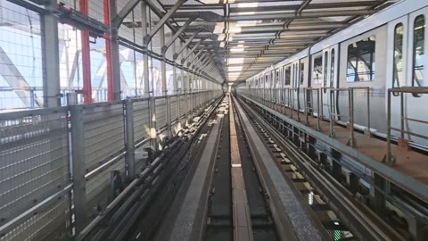 Time lapse of automatic train moving forward to tunnel on train line. Stock Footage 277677045