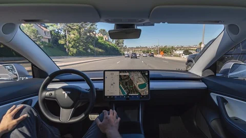 Time-lapse of autonomous Tesla electric vehicle full self driving autopilot Stock Footage 118645762