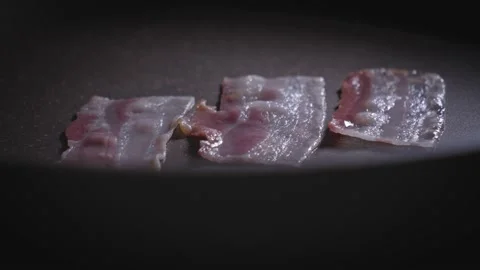 Time lapse of bacon fried in a pan 스톡 동영상 167183996