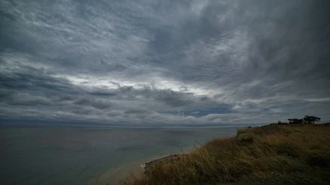A time lapse of bad weather, cloudy sky in sea shore. 4k Stock Footage 126120165