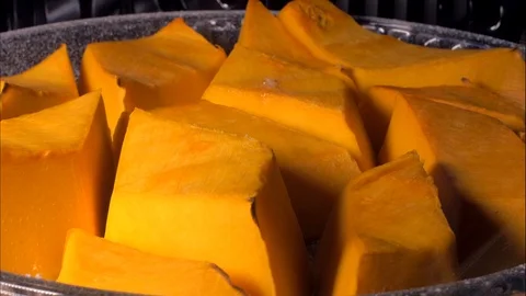 Time Lapse. Baking pumpkin in the oven Stock-Footage 105877850