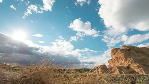 Time lapse of Bales of straw at the beautiful meadow landscape with moving Stock Footage 75333376