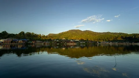 Time lapse of Ban Rak Thai Chinese village and reflection on lake at twilight Stock Footage 120544513