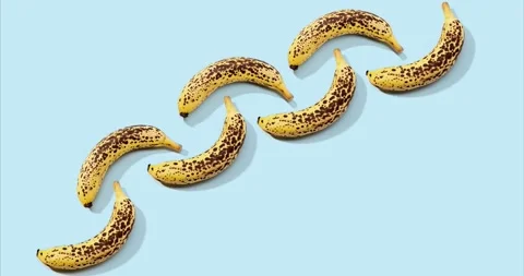 Time lapse of banana pattern on blue background Видео 135346691