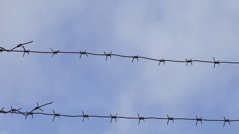 Time lapse barbed wire, clouds, sky Stock Footage 82359078