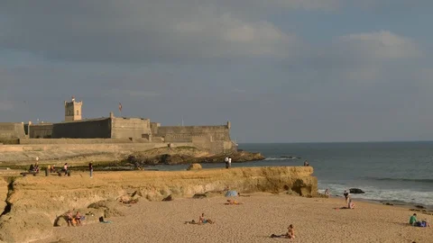 Time lapse of beach-goers relaxing at Carcavelos beach, Portugal Stock Footage 94658878