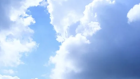 Time Lapse of Beautiful clear blue sky white clouds and puffy Stock Footage 242999597