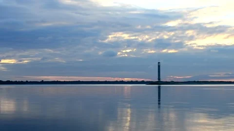 Time lapse of beautiful clouds at dawn with lighthouse Stock Footage 54452475