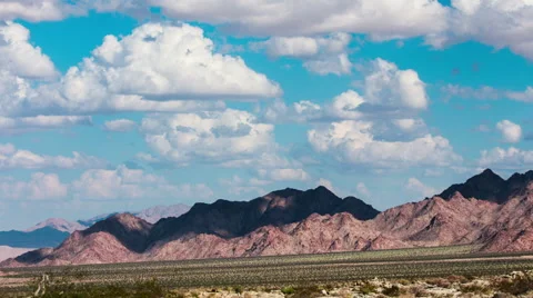 Time Lapse - Beautiful Clouds Moving Over Mountain Range Vídeos de archivo 54753627
