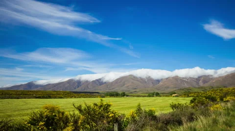Time Lapse - Beautiful Clouds Moving Over Mountain Range Video stock 58629855