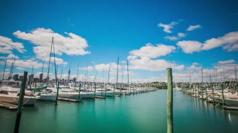 Time Lapse - Beautiful Clouds Moving Over Boats in Harbor Stock Footage 58630562