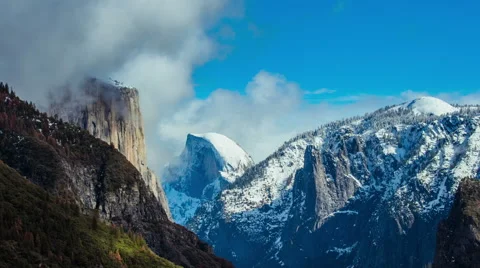 Time Lapse - Beautiful Clouds Moving Over Snowy Yosemite Mountains and Half Done Stock Footage 61183219