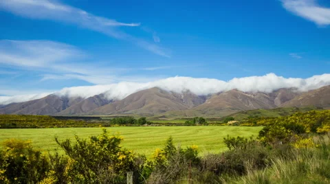 Time Lapse - Beautiful Clouds Moving Over Mountain Range 動画素材 65225470