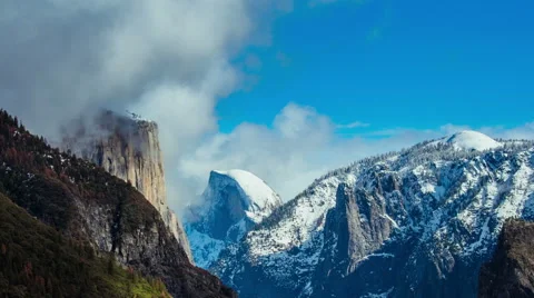 Time Lapse - Beautiful Clouds Moving Over Snowy Yosemite Mountains and Half Done Stock Footage 67585503