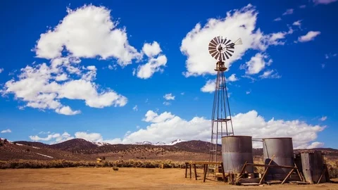 Time Lapse - Beautiful Clouds Moving Over Wind Mills Stock Footage 74245632