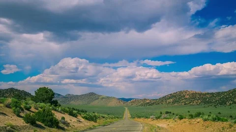 Time Lapse - Beautiful Clouds Moving Over the Road - 4K Stock Footage 77631369