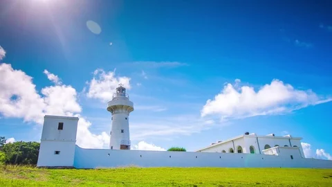 Time Lapse - Beautiful Clouds Moving Over Light House in Kenting, Taiwan - 4K Stock Footage 77631569
