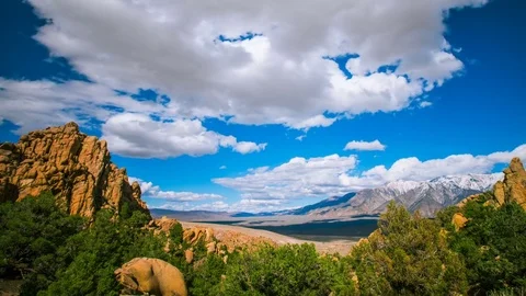 Time Lapse - Beautiful Clouds Moving Over Mountain Range and Valley Stock Footage 80454251