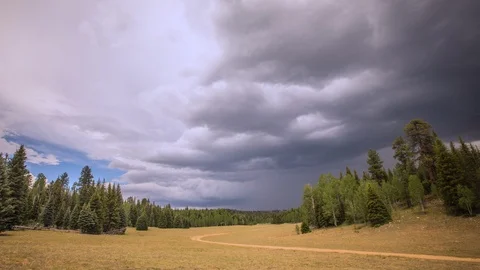 Time Lapse - Beautiful Clouds Moving Over Green Fields - 4K Stock Footage 92880125