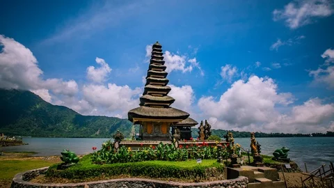 Time Lapse - Beautiful Clouds Moving Over Temple by the Lake - 4K Stock Footage 101703269