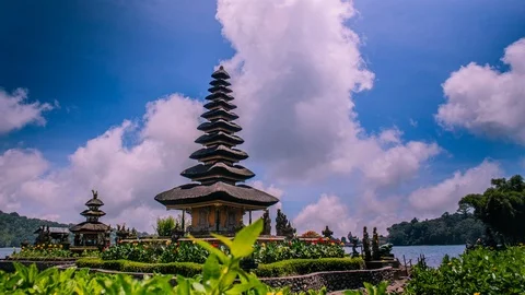Time Lapse - Beautiful Clouds Moving Over Temple by the Lake - 4K Video stock 104999198