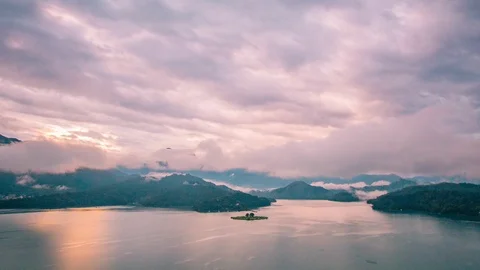 Time Lapse - Beautiful Clouds Moving Over Sun Moon Lake in Taiwan - 4K Stock Footage 104999972