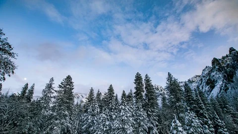 Time Lapse - Beautiful Clouds Moving Over Snowy Yosemite Forest - 4K Stock Footage 105849227