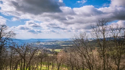Time Lapse - Beautiful Clouds Moving over Valley - 4K Stock Footage 105850911