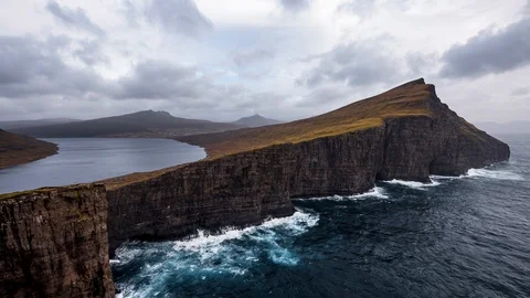 Time-lapse of beautiful clouds moving over ocean and cliffs Stock Footage 116598973