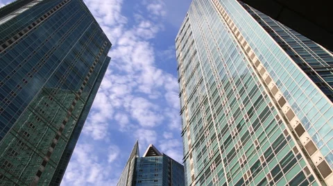 Time lapse of beautiful clouds reflected in mirrored facets of modern buildings Video stock 66681287