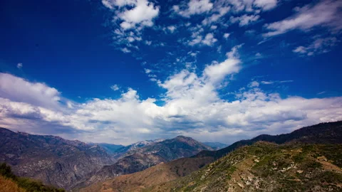 Time Lapse - Beautiful cloudscape moving over mountain rage and the valley Stock Footage 157033206