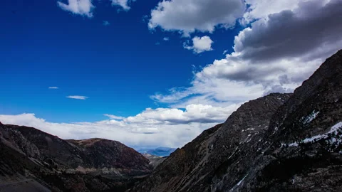 Time Lapse - Beautiful cloudscape moving over mountain rage and the valley Stock Footage 161120775