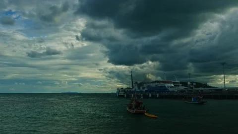 Time lapse at the beautiful cloudy day at the seashore with a pier. Stock Footage 154463756