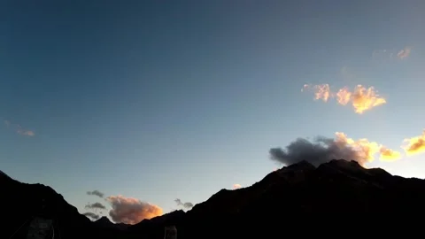 Time lapse of Beautiful cluds on sunset or sunrise over the silhouette mountain Stock Footage 194772004