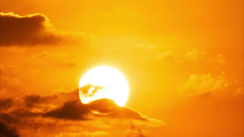 Time lapse of a beautiful dramatic sky with a big sun at sunrise. Stock Footage 259358219