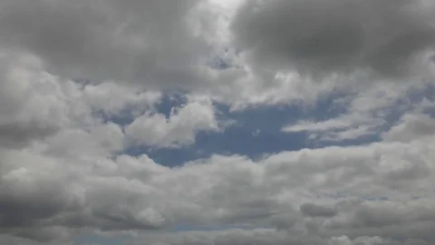 Time lapse. Beautiful fluffy clouds float in the sky. Stock Footage 77053655