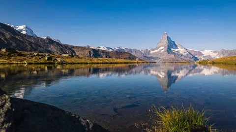 Time lapse of beautiful lake with reflections of the Matterhorn Switzerland. Stock Footage 114559755